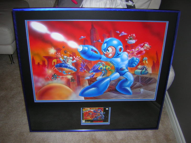 One piece in Dan’s collection is the original box art painting used for the Super NES game Mega Man 7. Photo courtesy ‘Bronty’